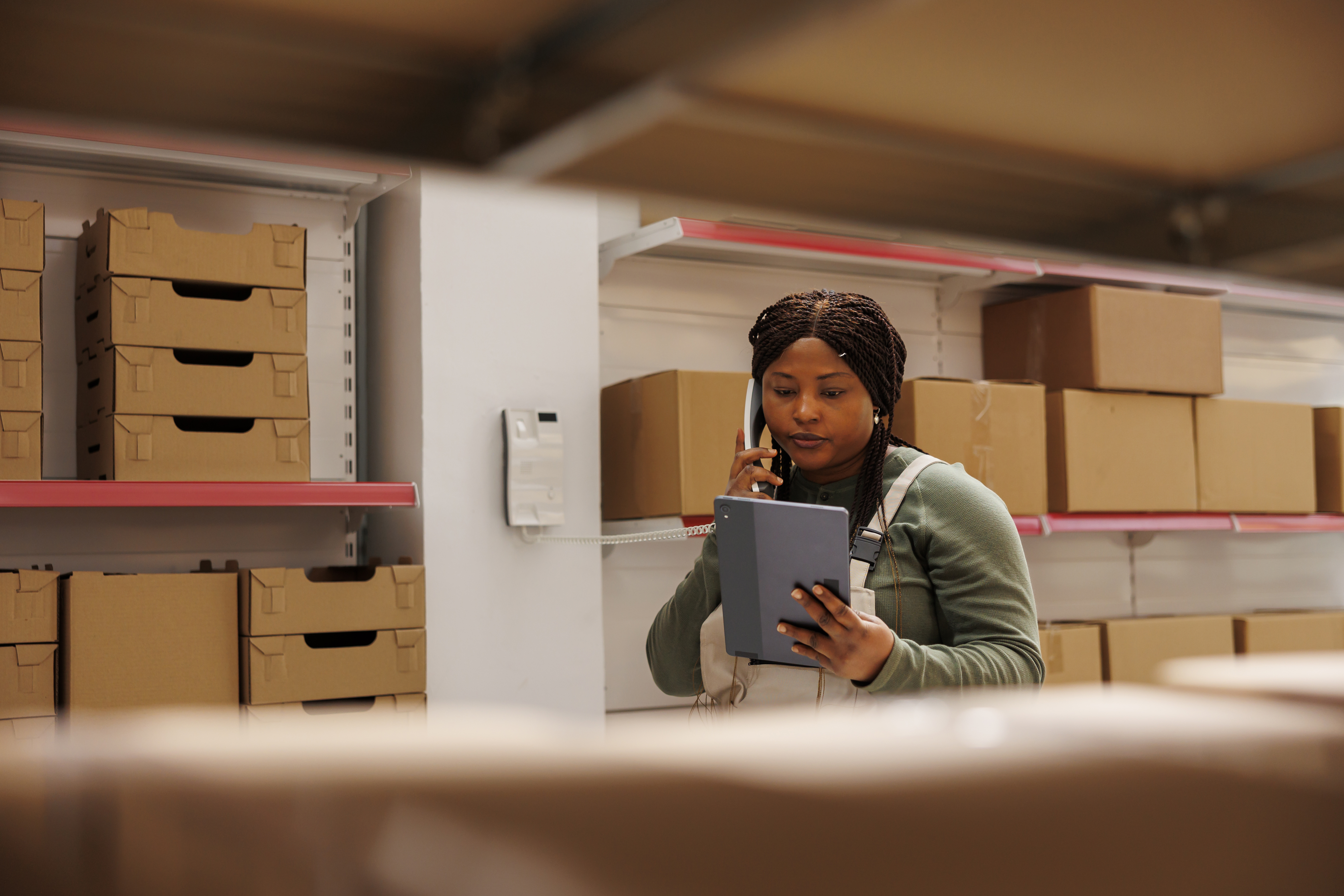 Nigerian entrepreneur efficiently managing business tasks using automation tools.
