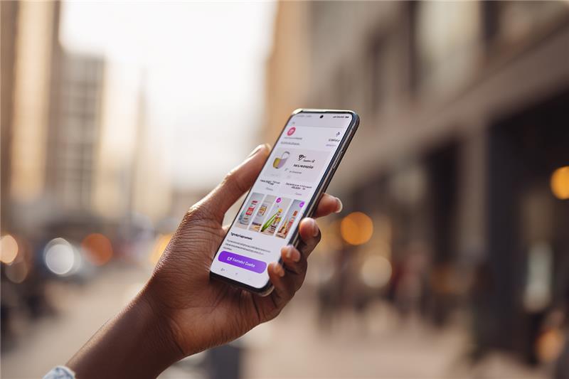 Phone screen showing a sleek online store with products ready to buy.